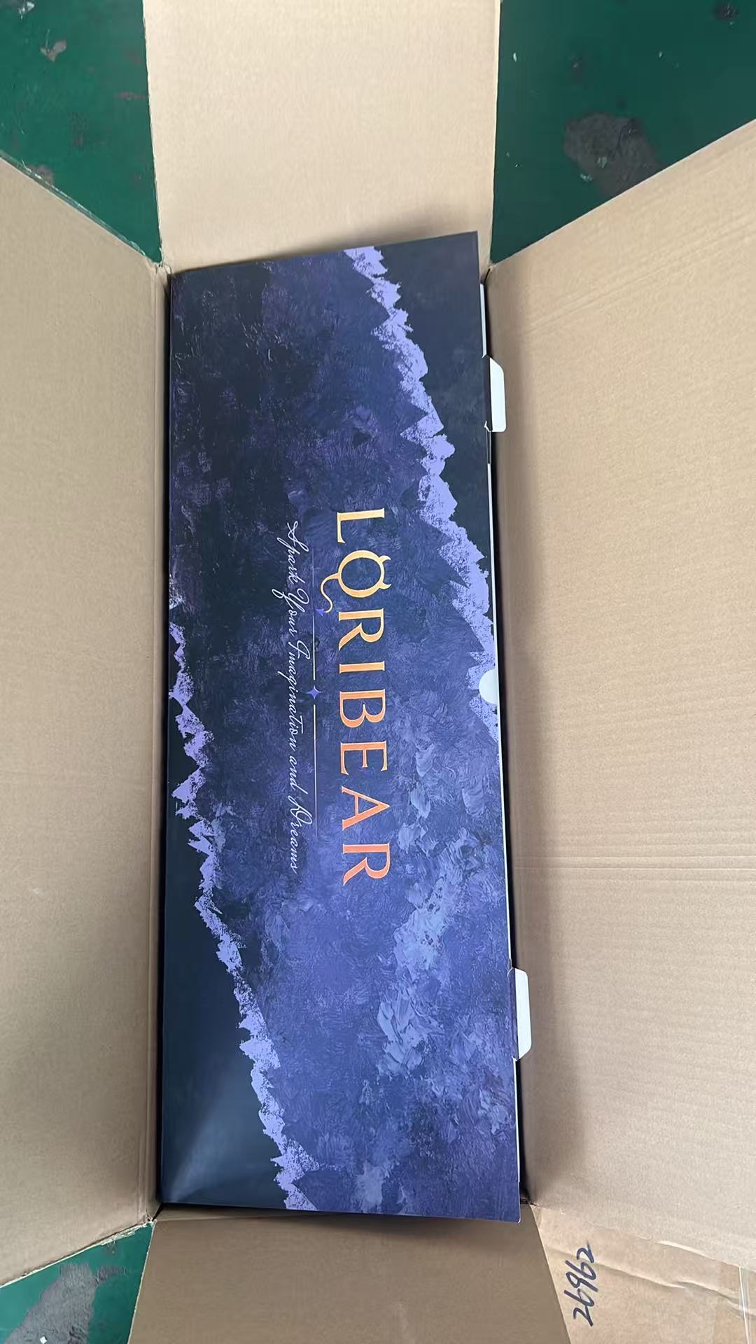 Printed LORIBEAR retail box inside its plain brown shipping carton