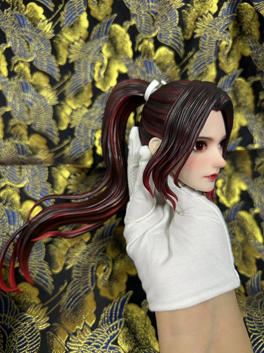 Side view of the hand-painted Mai Shiranui PU head showing the sculpted ponytail and gradient hair colour