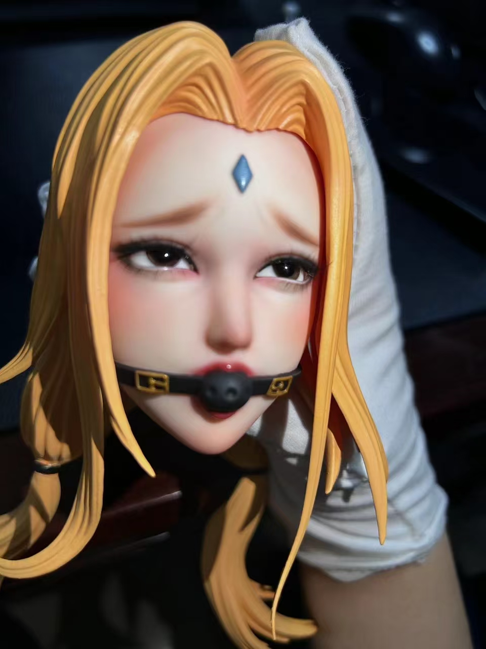 Hand-painted Tsunade face from a low angle, showing soft blush and glossy lips